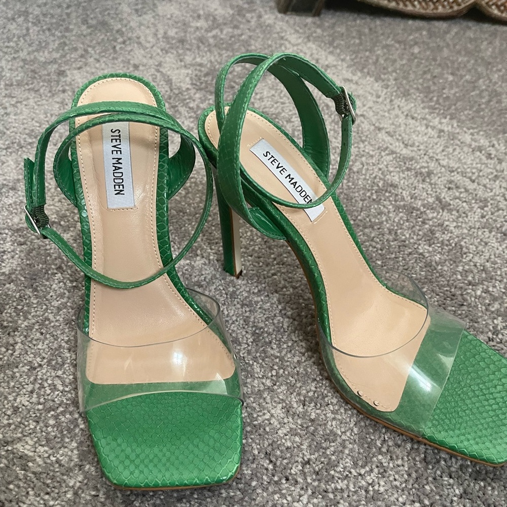Steve Madden green snake skin sandals with clear front band.